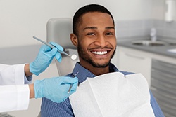 Patient in Plano smiling after getting a tooth-colored filling