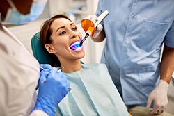 Patient in Plano getting a tooth-colored filling