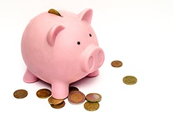 Piggy bank to save for dental implants in Plano. 