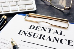 Paperwork for dental insurance coverage for dental implants in Plano  