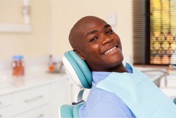 Man smiling after getting dental implants in Plano  
