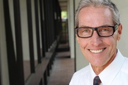 An older man smiling