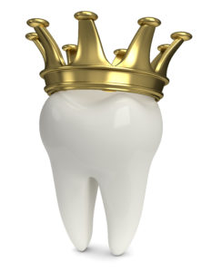 white tooth golden crown on top