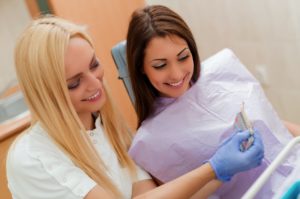 Woman getting porcelain veneers in Plano