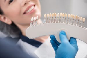 woman receiving porcelain veneers in Plano