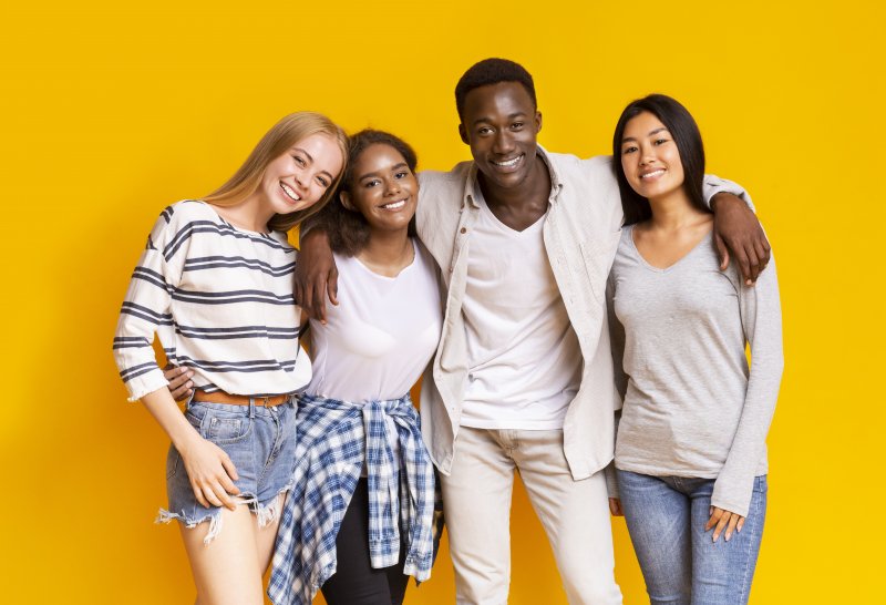 group of smiling teenagers