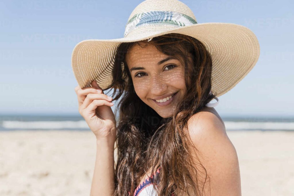 person smiling on beach