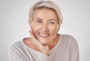 an older woman enjoying her straighter smile after Invisalign